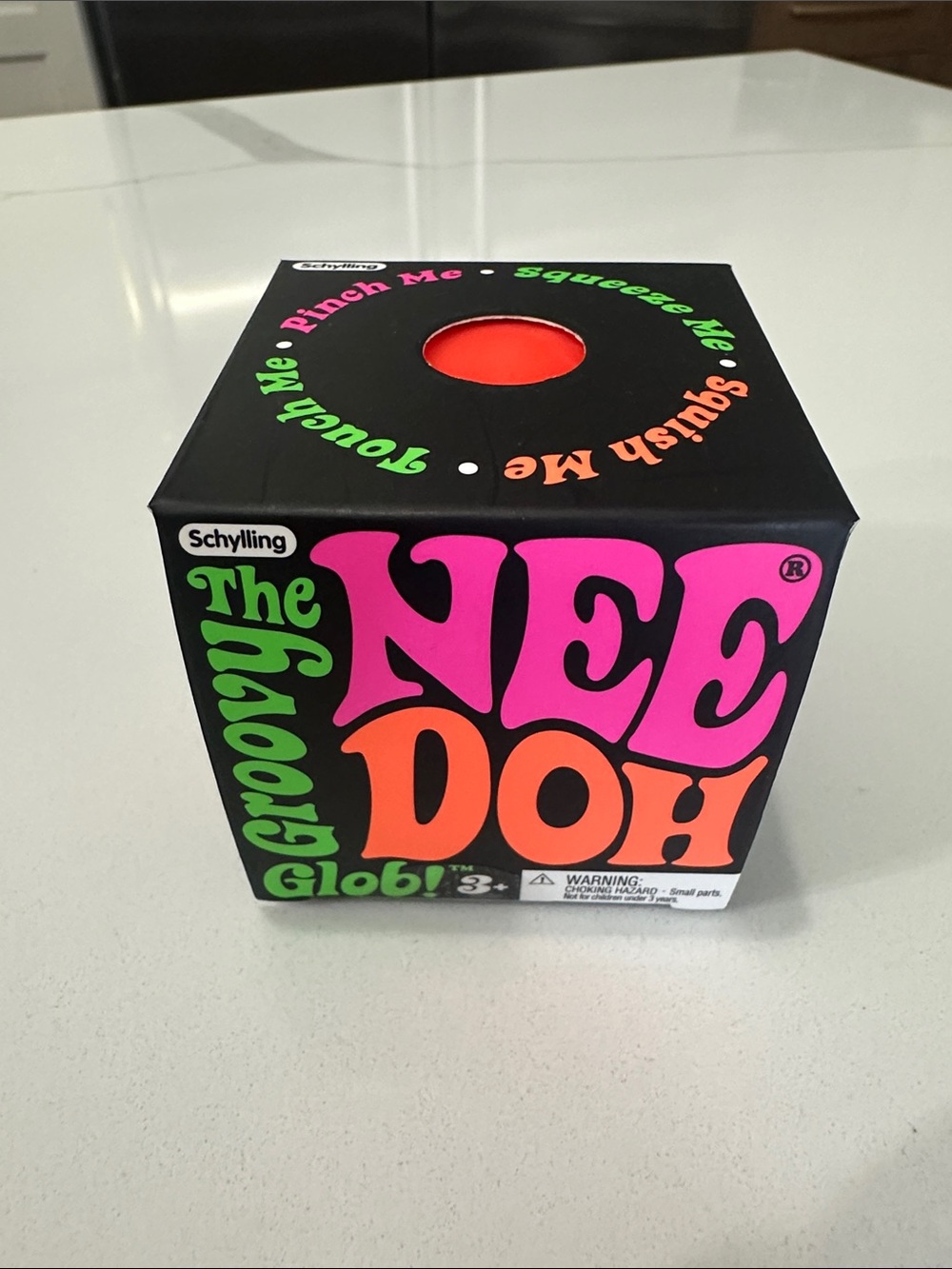 The NeeDoh Groovy Glob - Orange Stress Toy